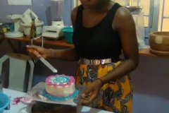 Miss-Sophia-decorating-her-cake-for-her-final-practical-class